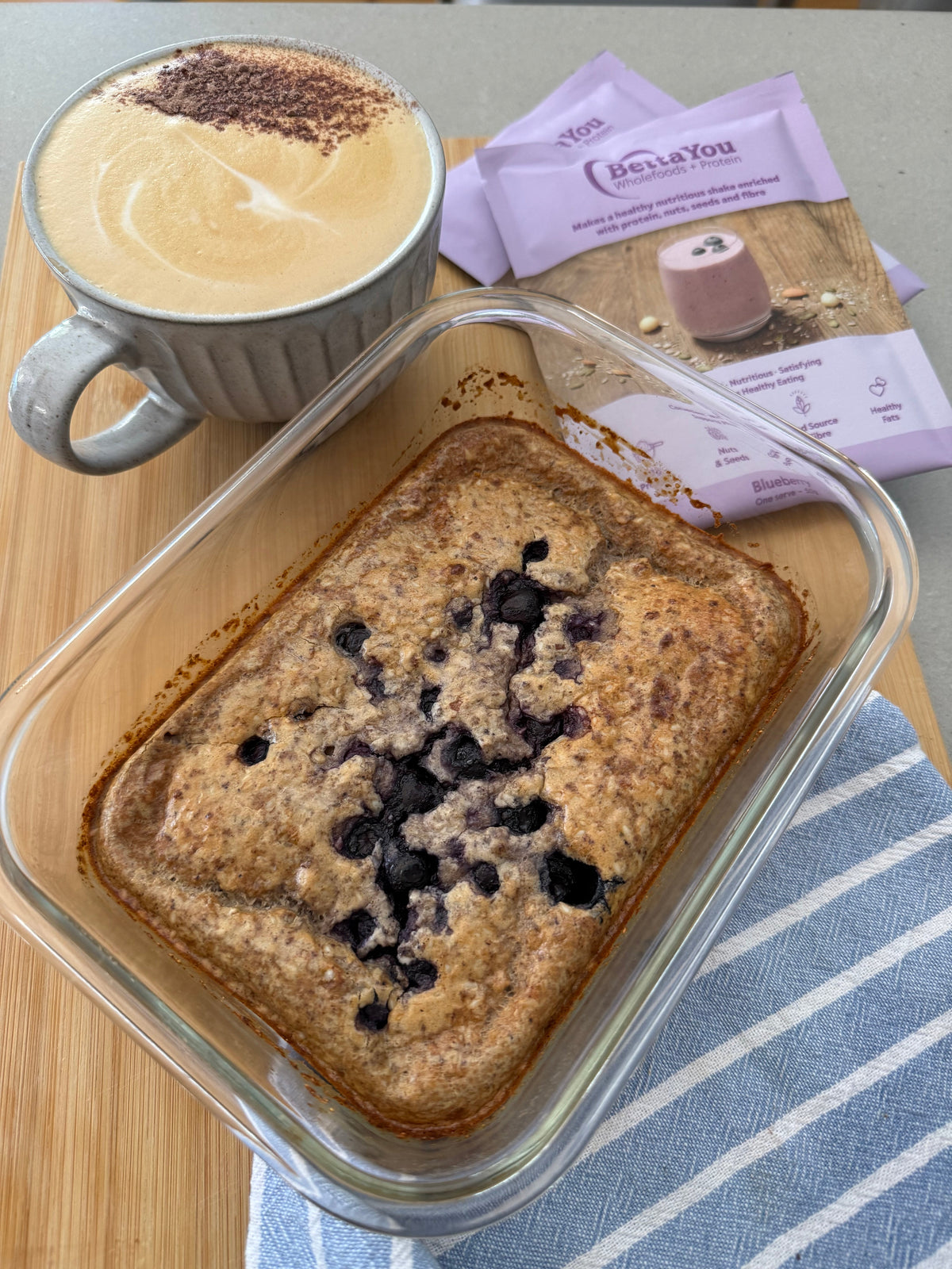 BettaYou blueberry protein pancake bowl topped with fresh blueberries and yoghurt